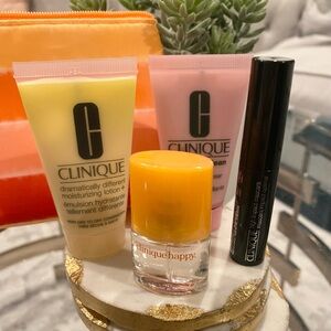 Clinique 5 piece Essentials Set - including Happy perfume spray and makeup bag